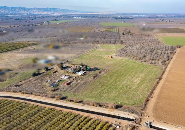 bird's eye view with a mountain view and a rural view