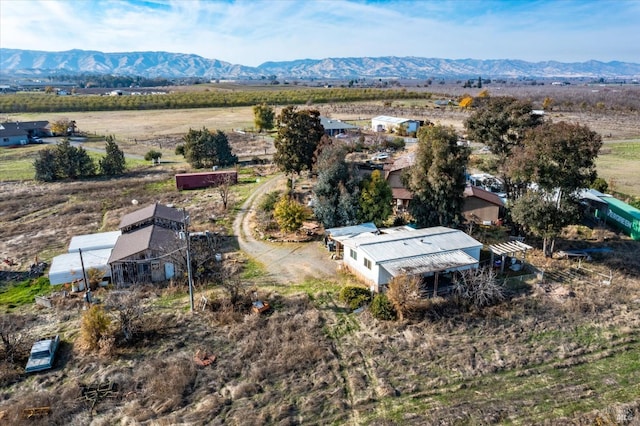 birds eye view of property featuring a mountain view