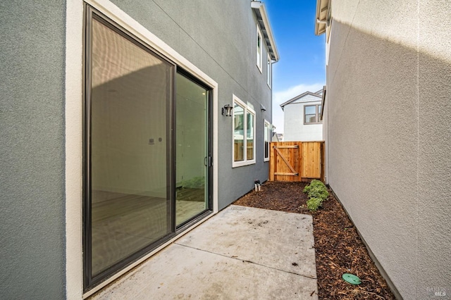 view of patio / terrace featuring a gate and fence