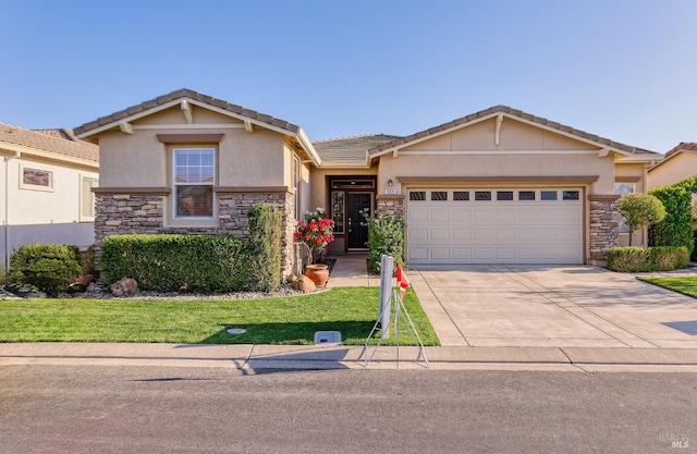 view of front of house with a garage and a front yard