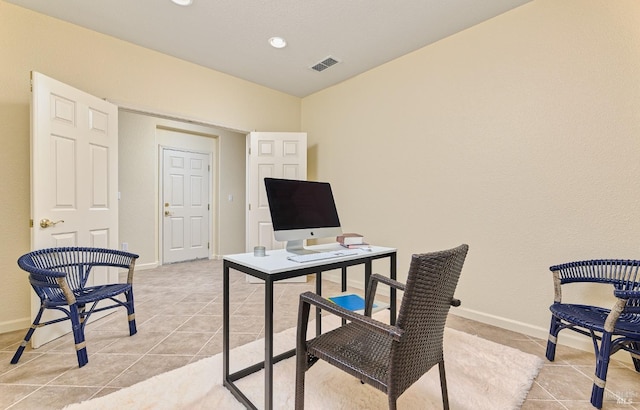 office space with light tile patterned floors