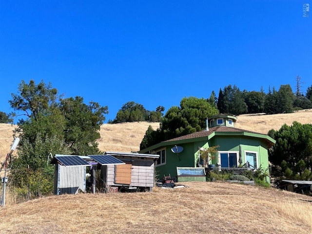 view of front facade with an outbuilding