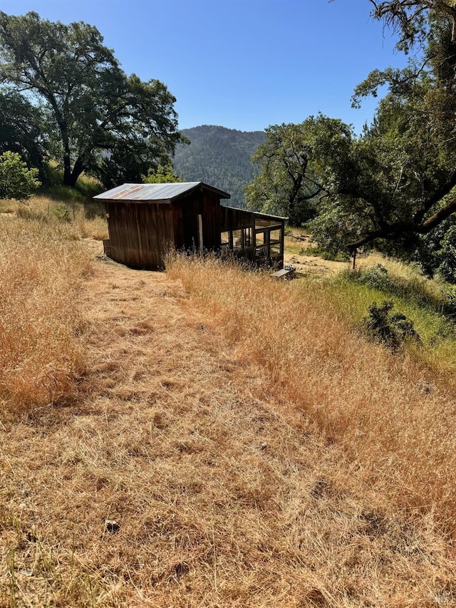 exterior space with a mountain view and a rural view