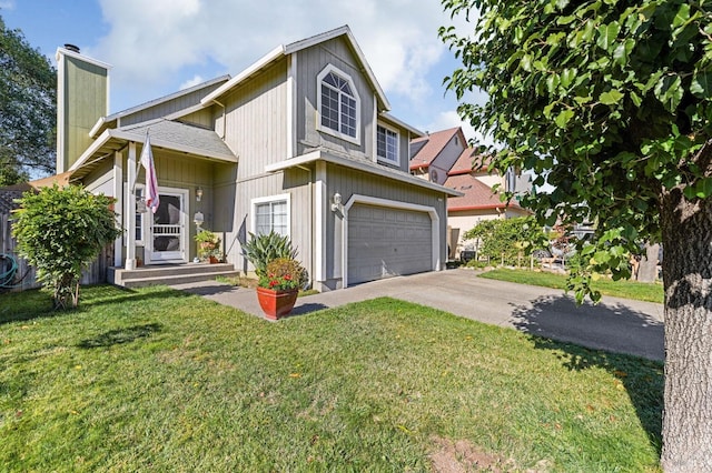 view of front of property with driveway, an attached garage, a chimney, and a front lawn