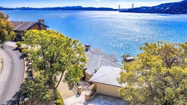 birds eye view of property featuring a water and mountain view