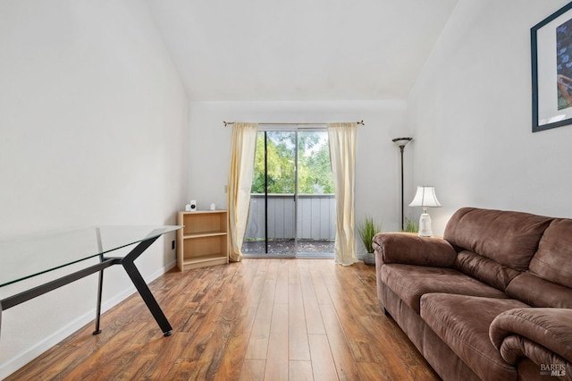 living room with lofted ceiling and wood-type flooring