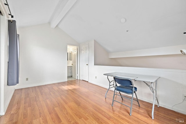 office with light hardwood / wood-style flooring and lofted ceiling with beams