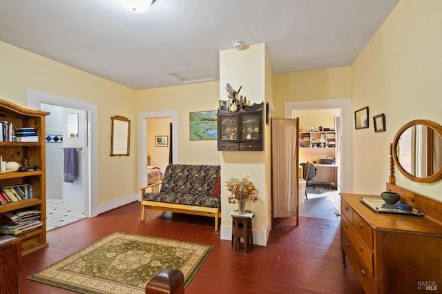 hallway with dark wood-style floors and baseboards