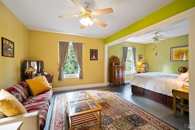 bedroom featuring ceiling fan and baseboards