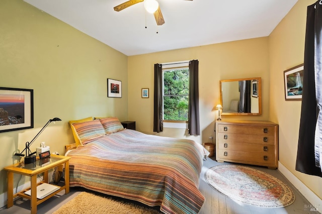 bedroom featuring ceiling fan and baseboards