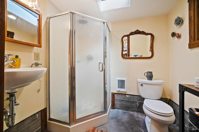 full bath with toilet, a stall shower, and heating unit