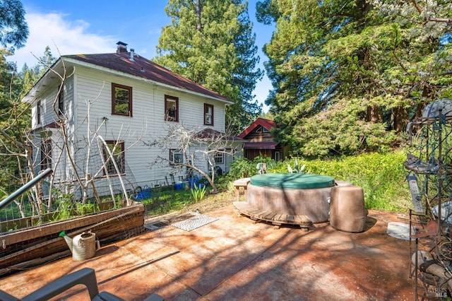 rear view of house featuring a patio