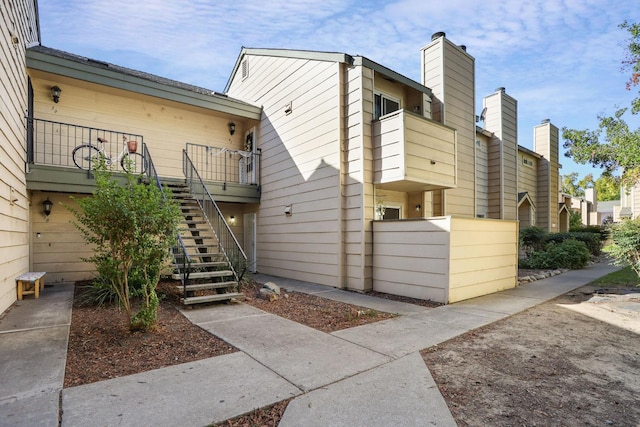 view of home's exterior featuring a balcony