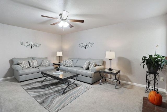 carpeted living room with ceiling fan