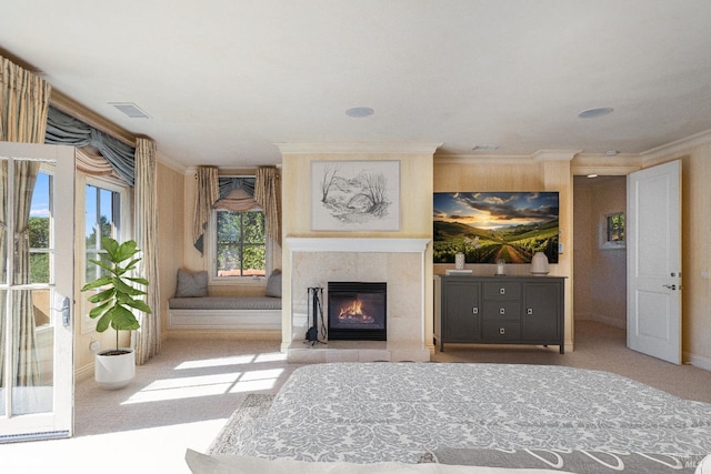 unfurnished room featuring ornamental molding, a high end fireplace, and light carpet