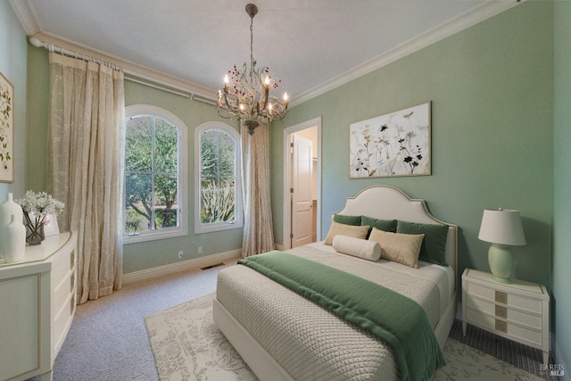 carpeted bedroom featuring a notable chandelier and ornamental molding