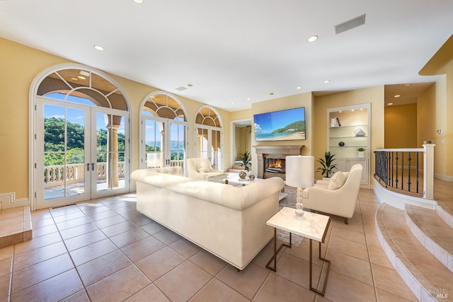 tiled living room with french doors and built in features