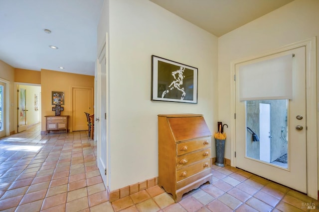 entrance foyer featuring light tile patterned flooring