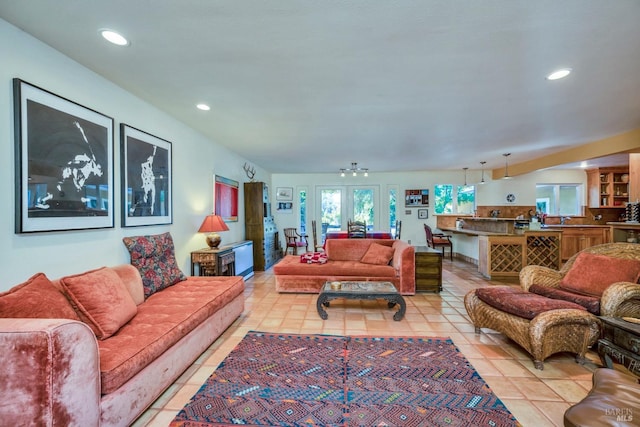 living room with light tile patterned floors and french doors