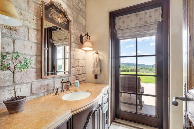 bathroom with vanity and a mountain view