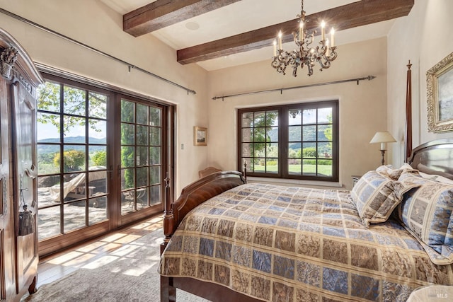 bedroom with french doors, beam ceiling, and a notable chandelier