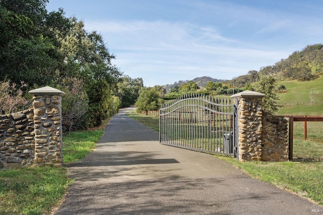 view of gate featuring a rural view