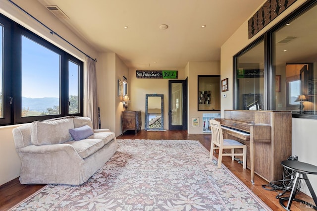 living room with a mountain view and hardwood / wood-style flooring