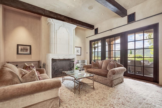 living room with a premium fireplace and beamed ceiling