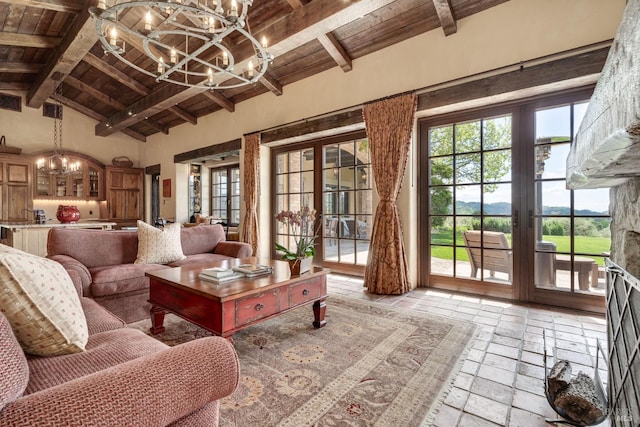 living room featuring a notable chandelier, high vaulted ceiling, beamed ceiling, and wooden ceiling