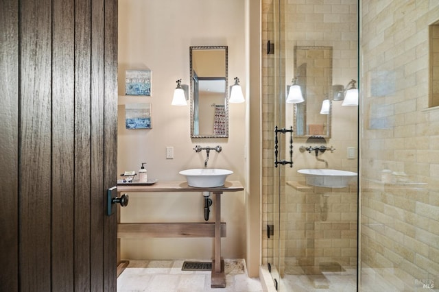 bathroom featuring vanity, tile patterned flooring, and an enclosed shower