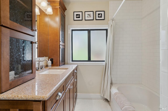 bathroom featuring vanity, shower / tub combo with curtain, and tile patterned floors