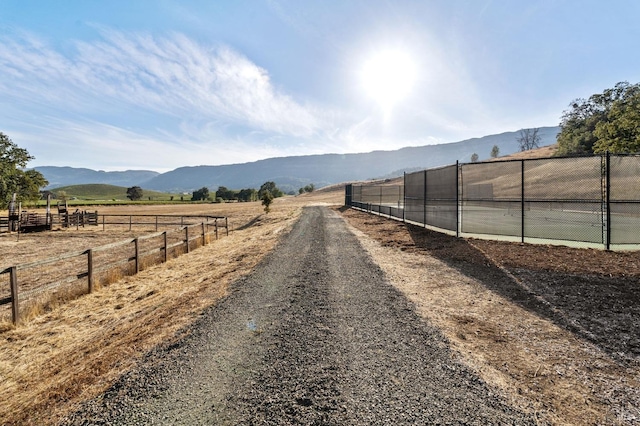 view of road featuring a rural view and a mountain view