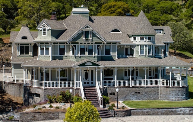 victorian house featuring covered porch