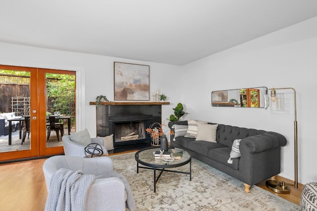 living room featuring french doors and light hardwood / wood-style flooring