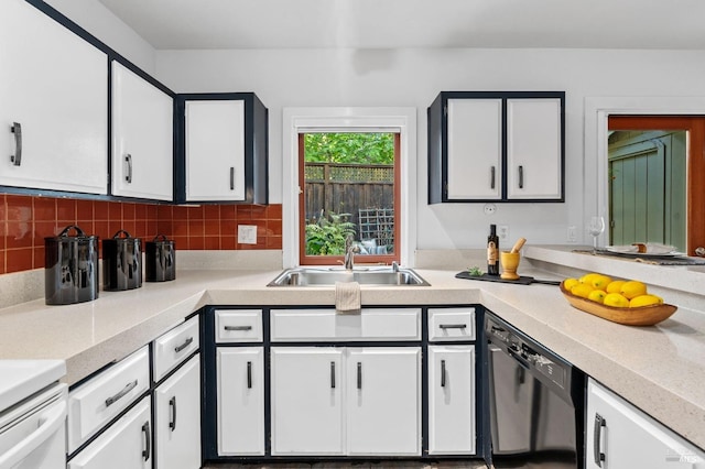 kitchen featuring white cabinetry, decorative backsplash, sink, and dishwasher