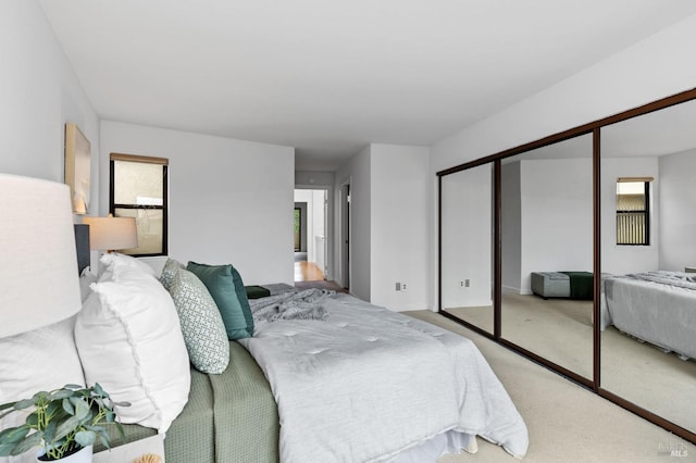 carpeted bedroom featuring a closet