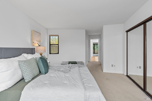 carpeted bedroom with a closet