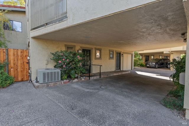 exterior space featuring a carport and central AC