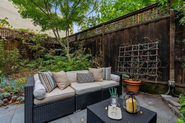 view of patio / terrace featuring a fenced backyard and an outdoor living space