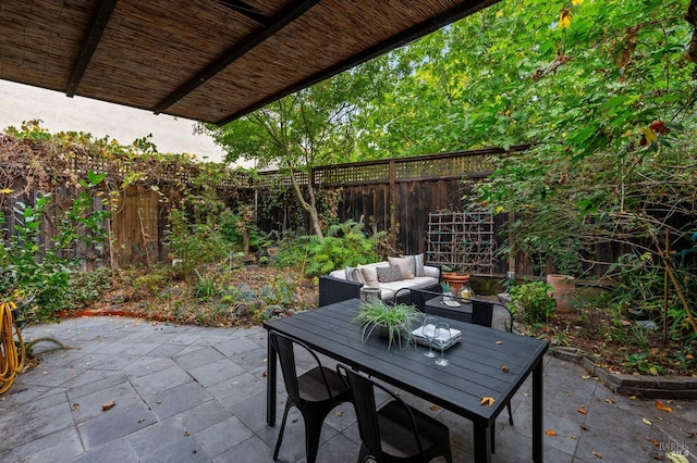 view of patio / terrace with outdoor dining area and a fenced backyard