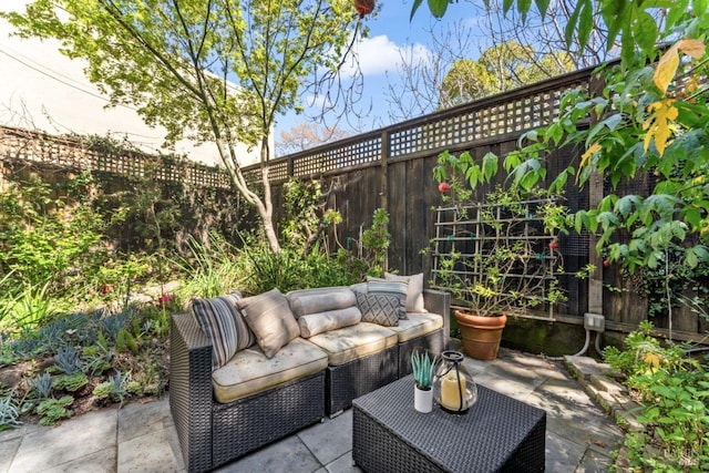 view of patio / terrace featuring an outdoor hangout area and a fenced backyard