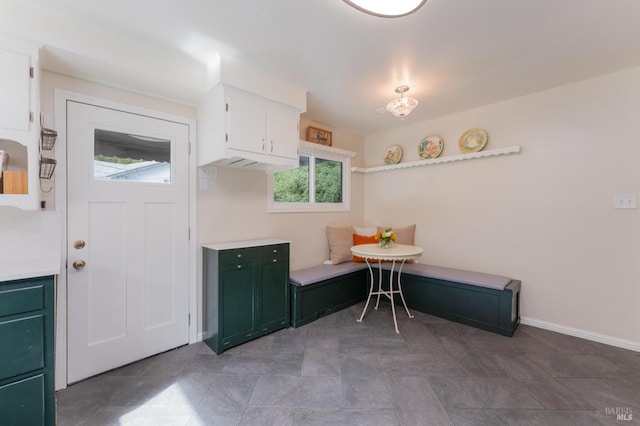 kitchen featuring breakfast area and white cabinets