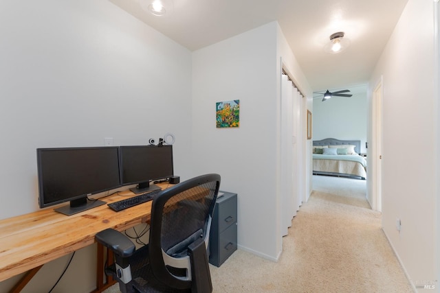 office with light colored carpet and ceiling fan