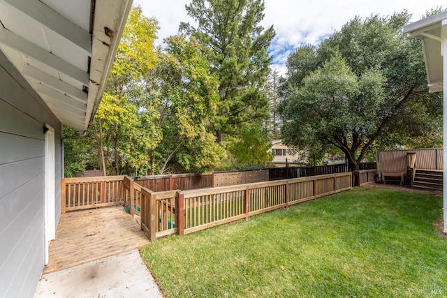 view of yard with a wooden deck