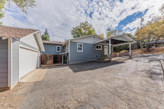 back of property with a garage