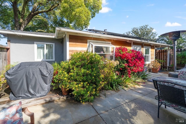 rear view of property featuring a patio