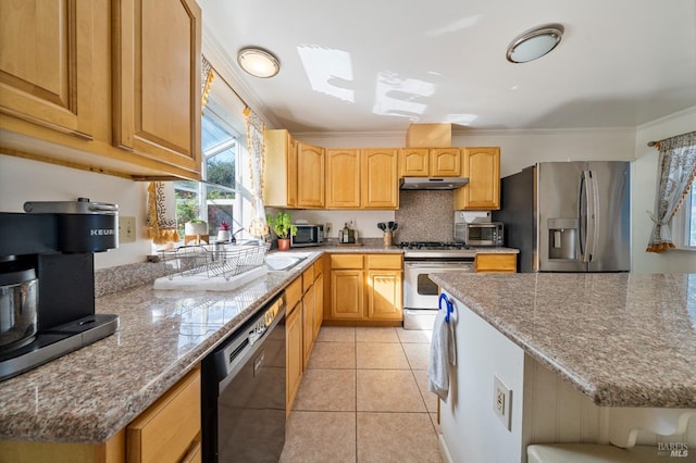 kitchen featuring ornamental molding, light tile patterned flooring, light stone countertops, appliances with stainless steel finishes, and light brown cabinetry