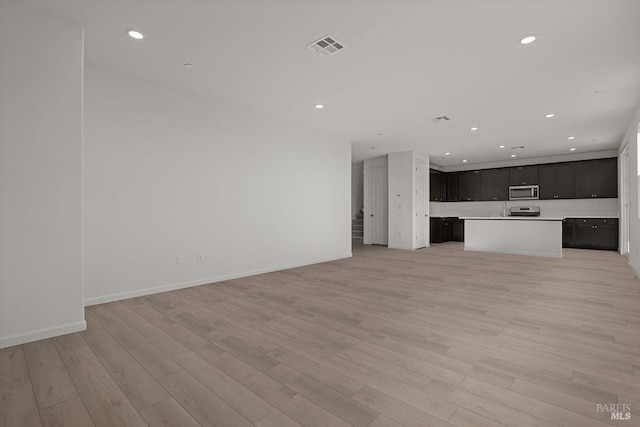 unfurnished living room featuring light hardwood / wood-style floors