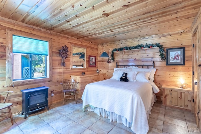 tiled bedroom with a wood stove, wooden walls, and wooden ceiling