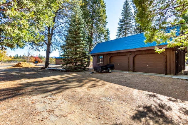 exterior space featuring an outbuilding and a garage